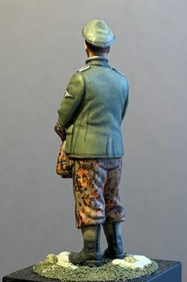 German officer holding parka